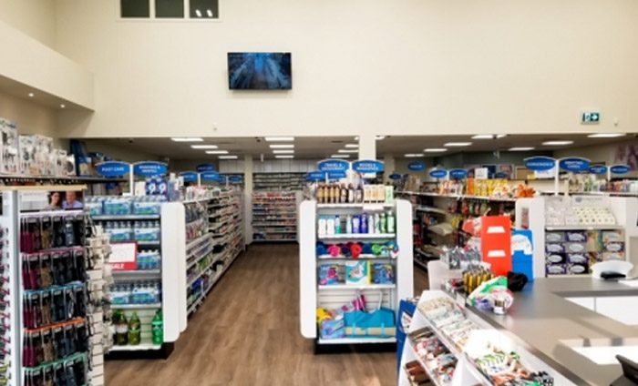 aisles filled with products in a pharmacy store