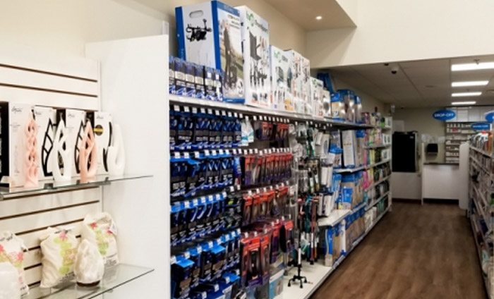 an aisle of products on shelfs in a pharmacy store