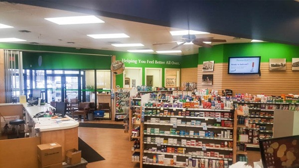 aisles filled with products in a pharmacy store